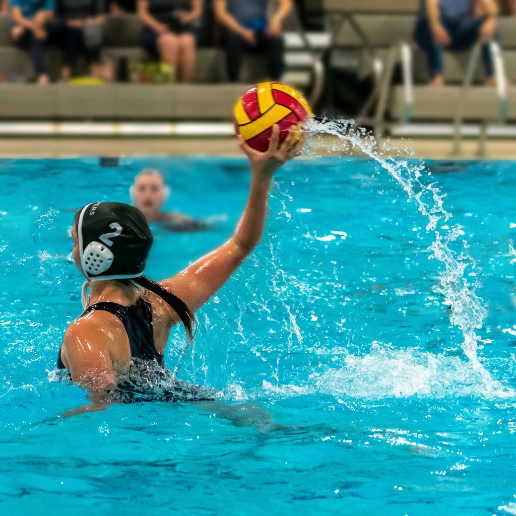 Water polo player throwing a ball